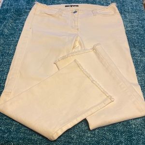 Beautiful cream colored jeans by Theory- fringed!